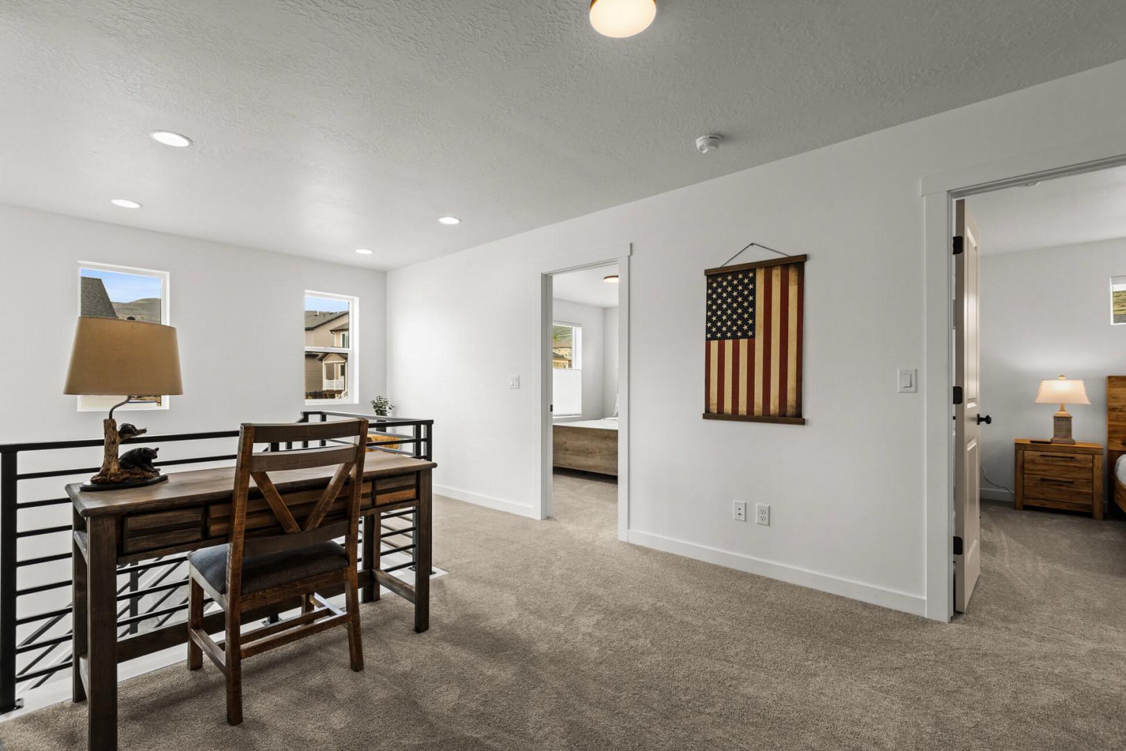 Your bright upstairs workspace offers a quiet desk area with views, plus easy access to bedrooms for a productive stay.