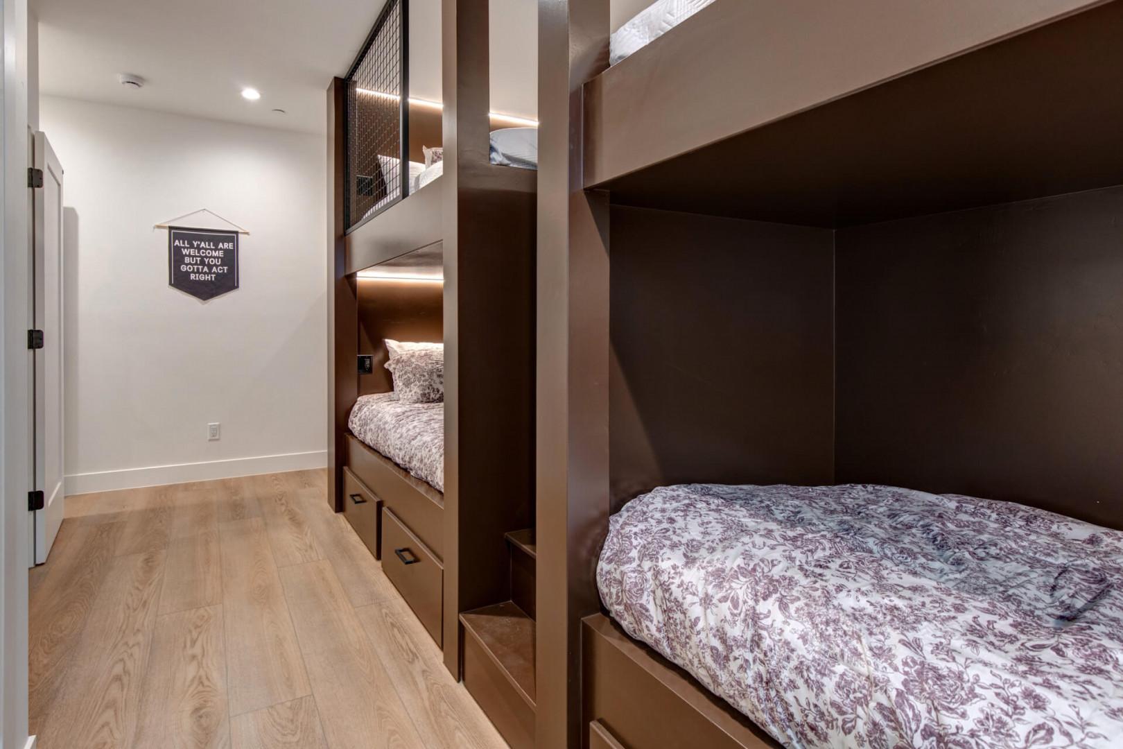 Upper Main 301: Your kids will love these custom bunk beds with cozy built-in lighting and under-bed storage drawers.
