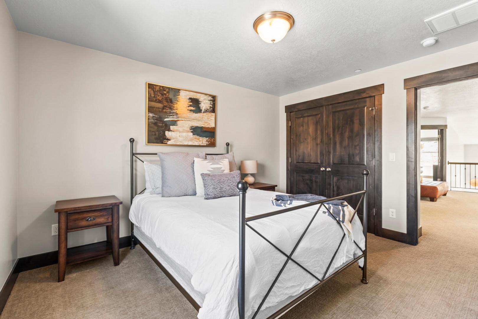 Settle into your cozy bedroom featuring crisp linens and rustic touches that create the perfect mountain retreat atmosphere.