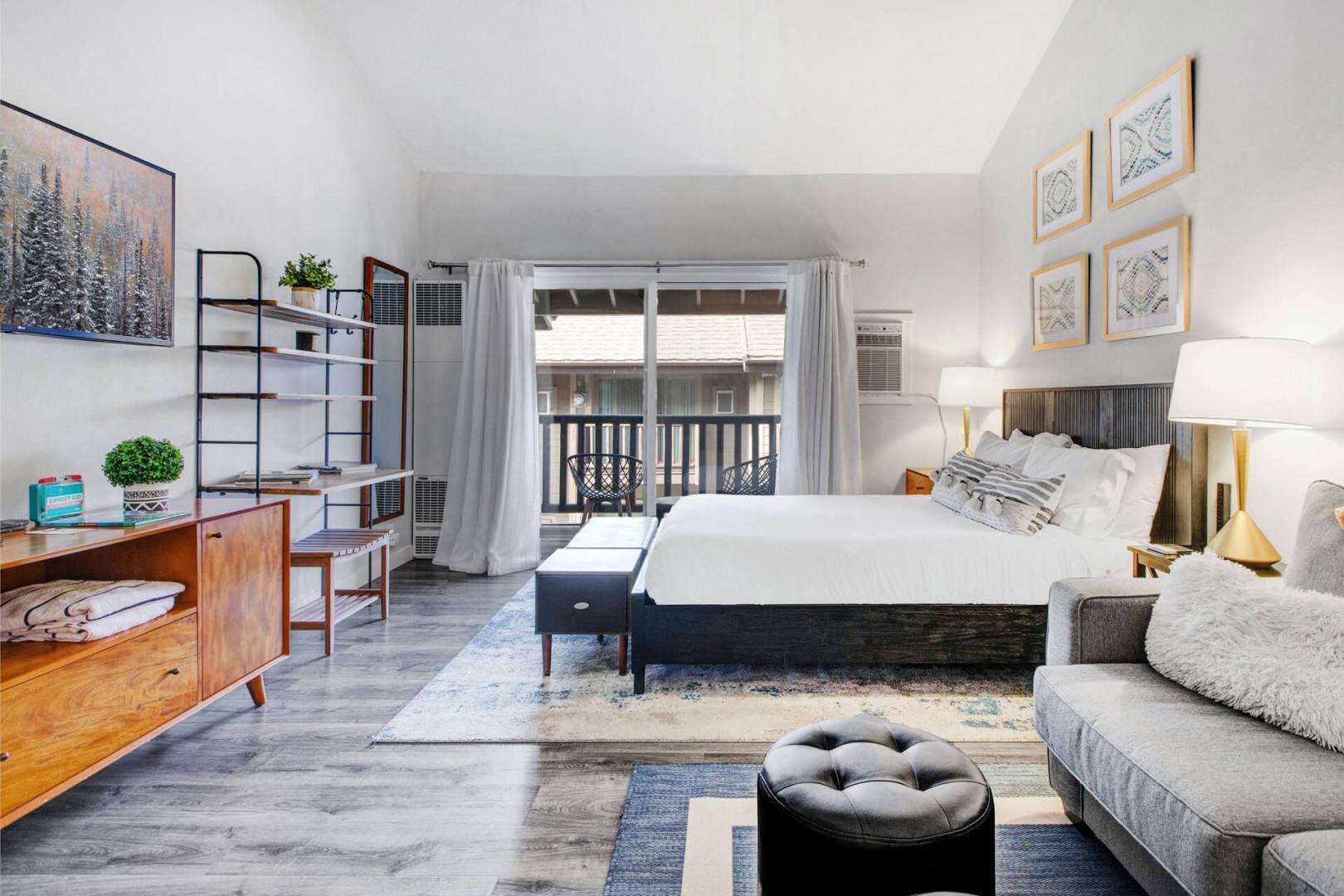 Unwind in your stylish studio with plush bedding, cozy seating, and thoughtful touches that make this space feel like home.