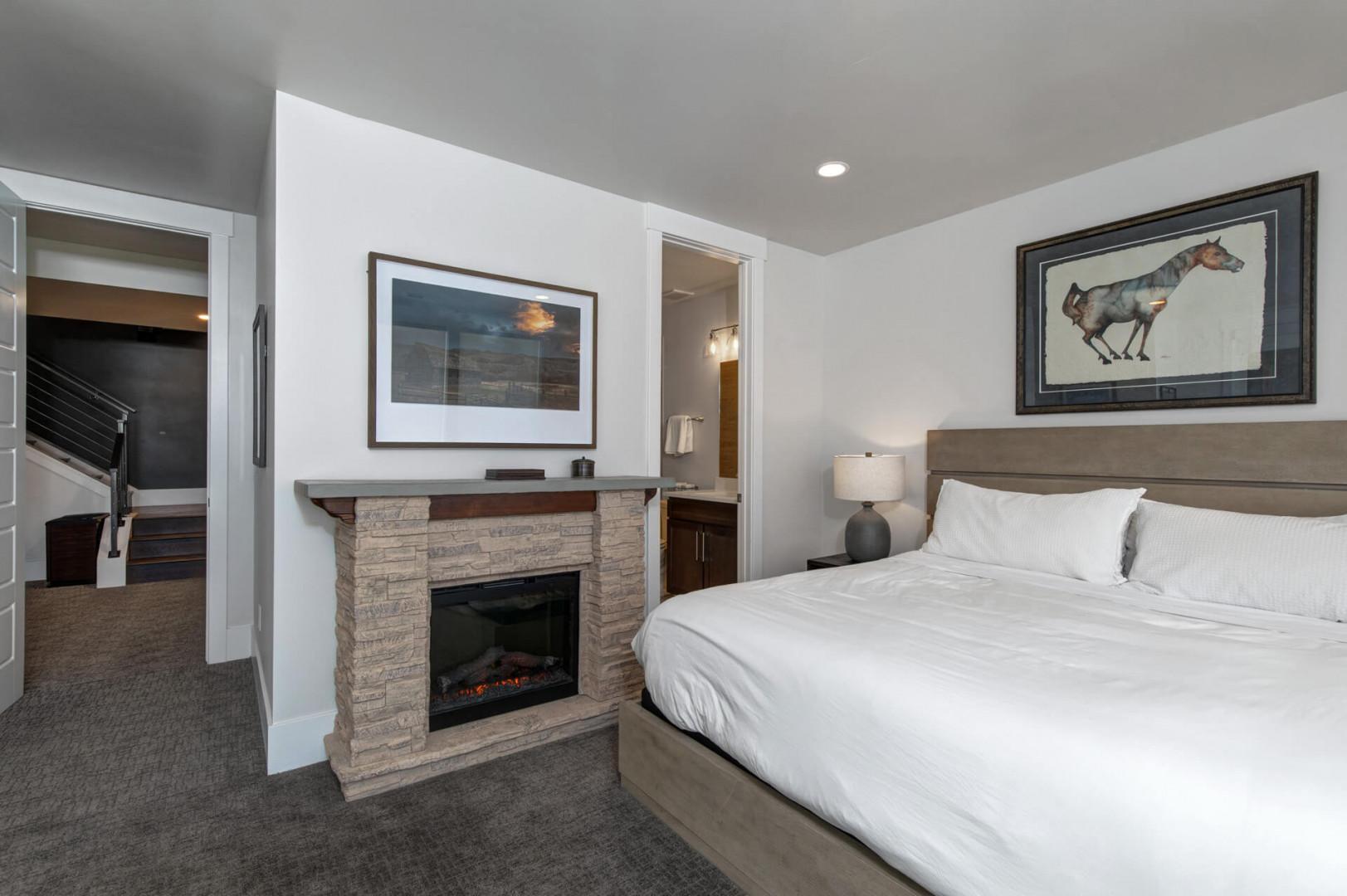 Deer Springs 12797: The lower-level second guest bedroom offers a king bed, cozy fireplace, and an ensuite bathroom.