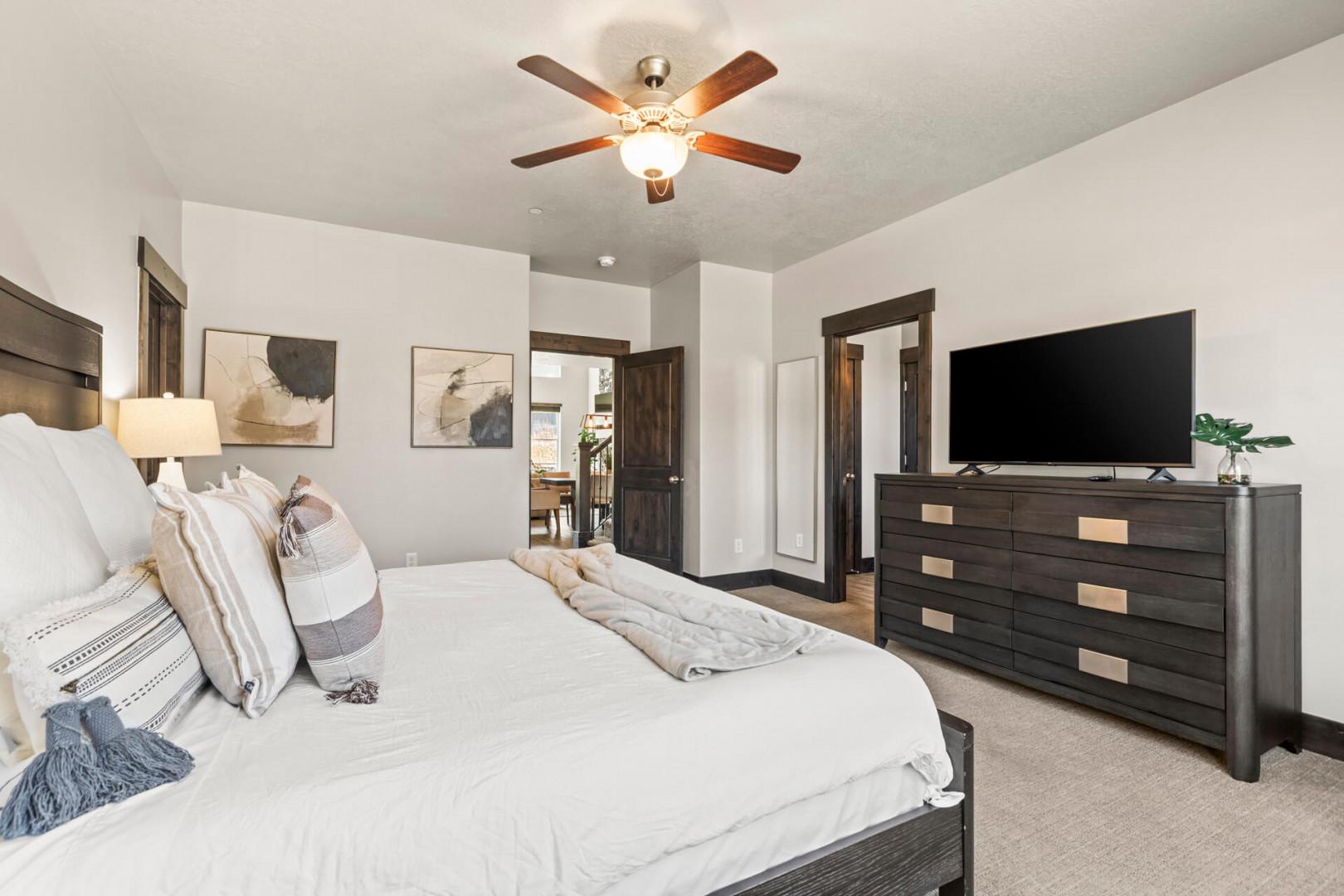 Sink into comfort in your serene bedroom featuring plush bedding, modern amenities, and thoughtful touches for the perfect restful retreat.