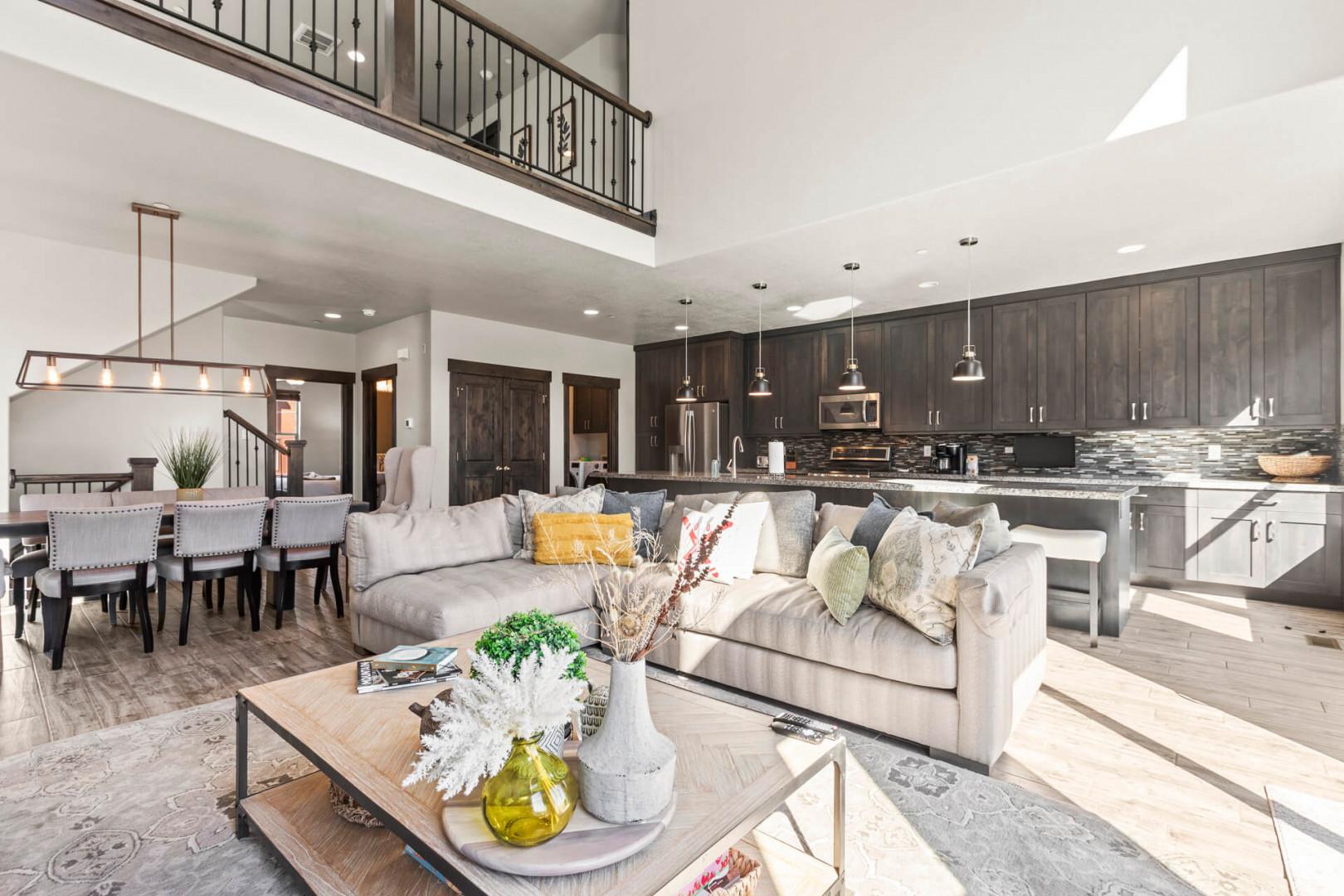 Relax in your spacious open-concept haven where modern comfort meets rustic charm, featuring soaring ceilings and thoughtful design throughout.