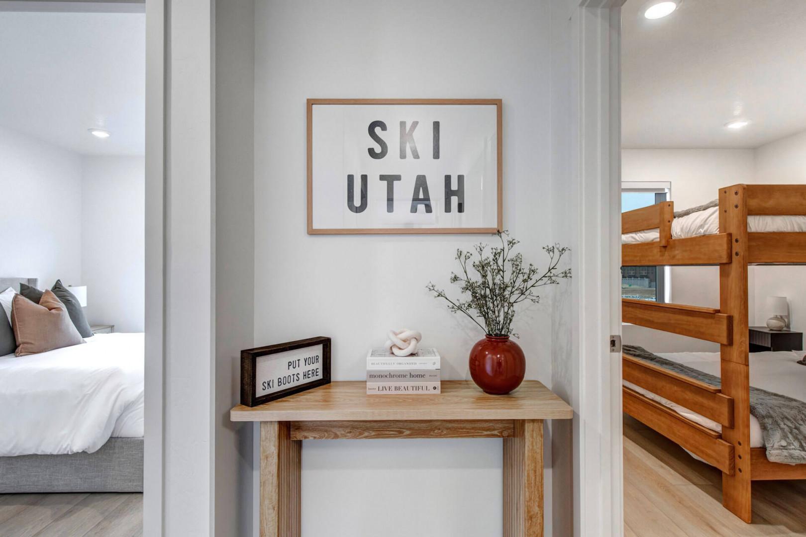 Your ski adventure begins in this charming hallway where thoughtful touches like a 'Ski Utah' sign set the perfect mountain mood.