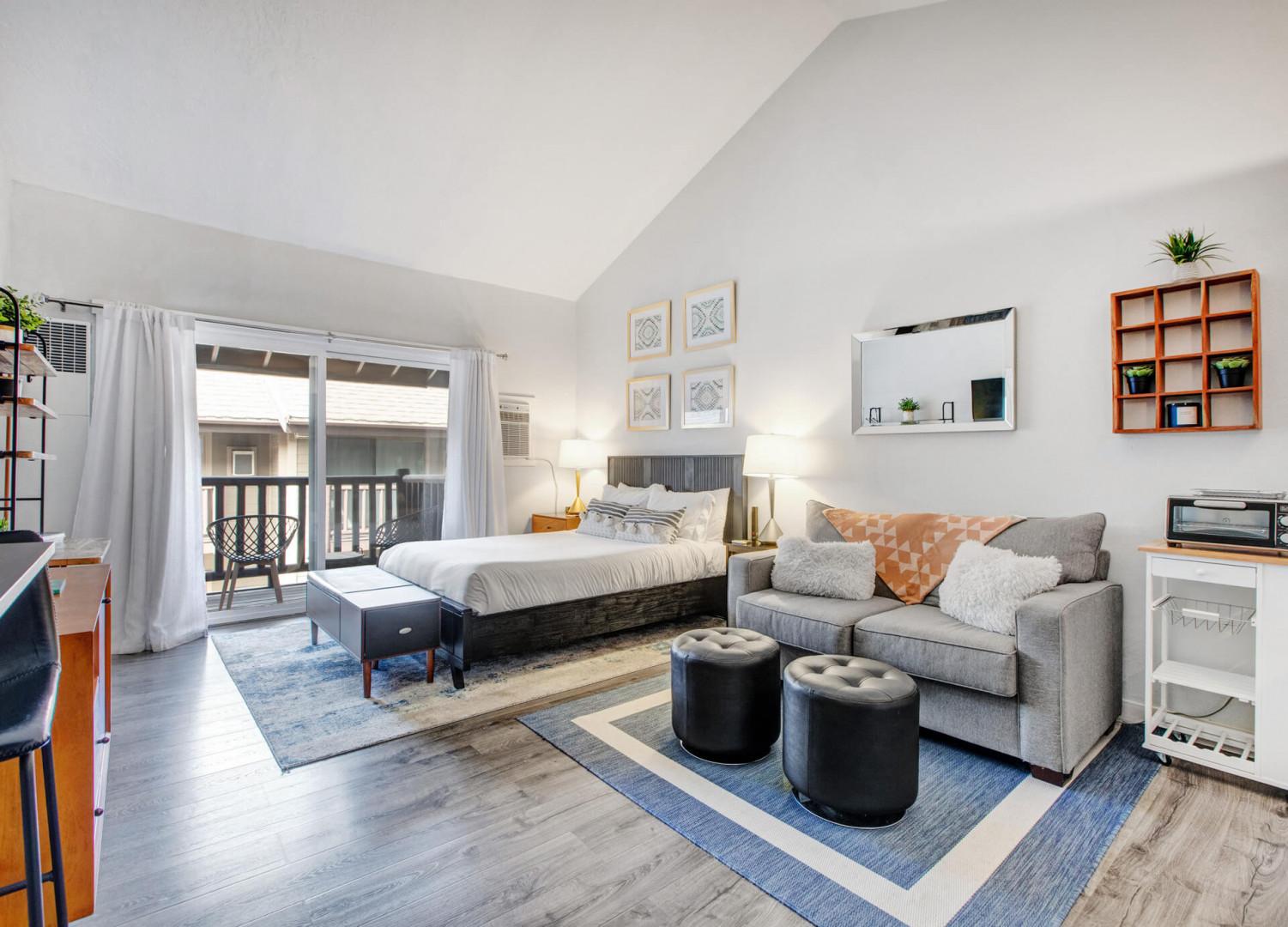 Your stylish studio combines comfort and function with a cozy queen bed, plush sofa, and modern kitchenette—perfect for relaxing after exploring.