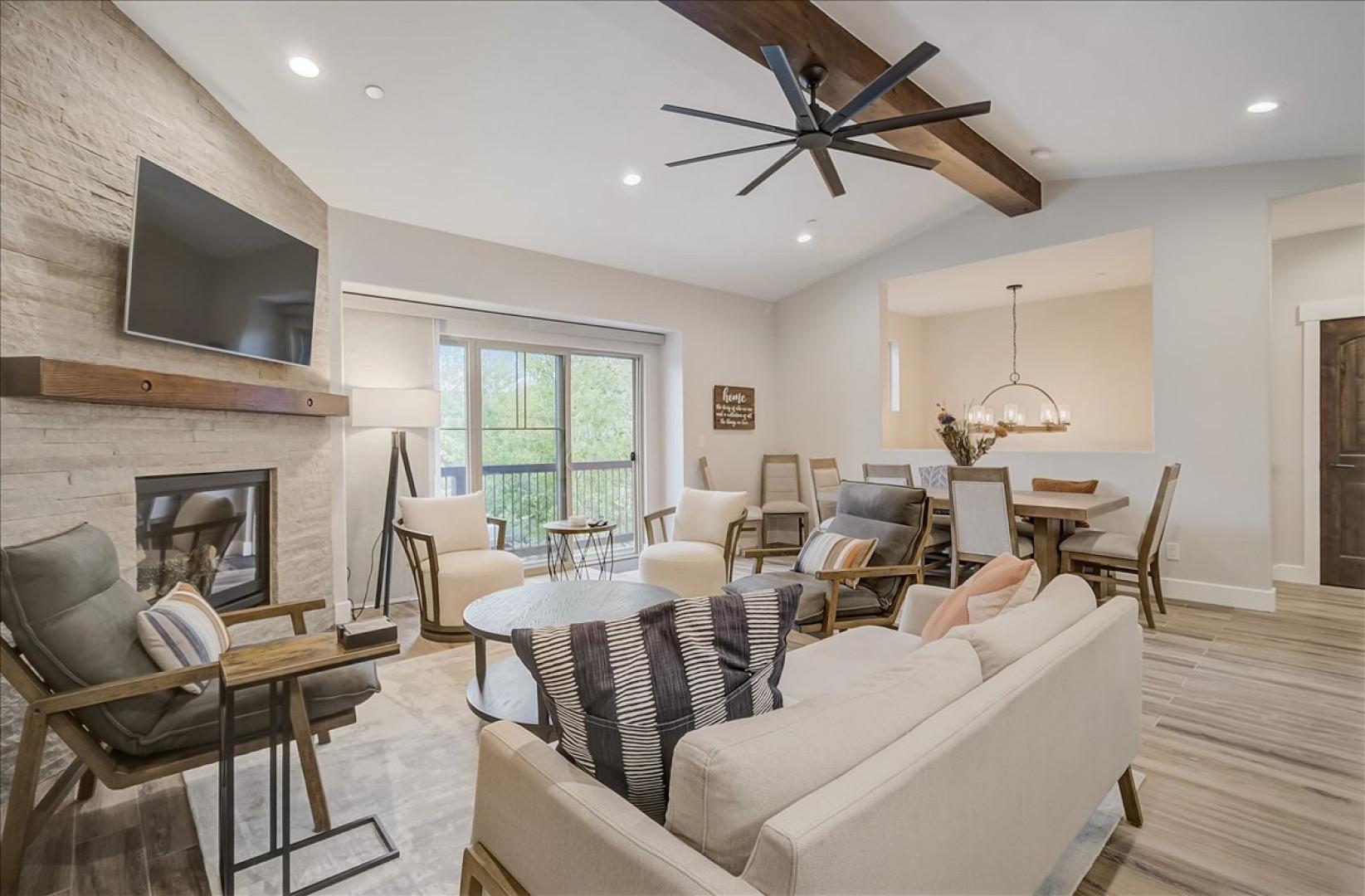 Black Rock Ridge 14202:  Living Room: "Cozy corner with fireplace, TV, and balcony view through sliding door."