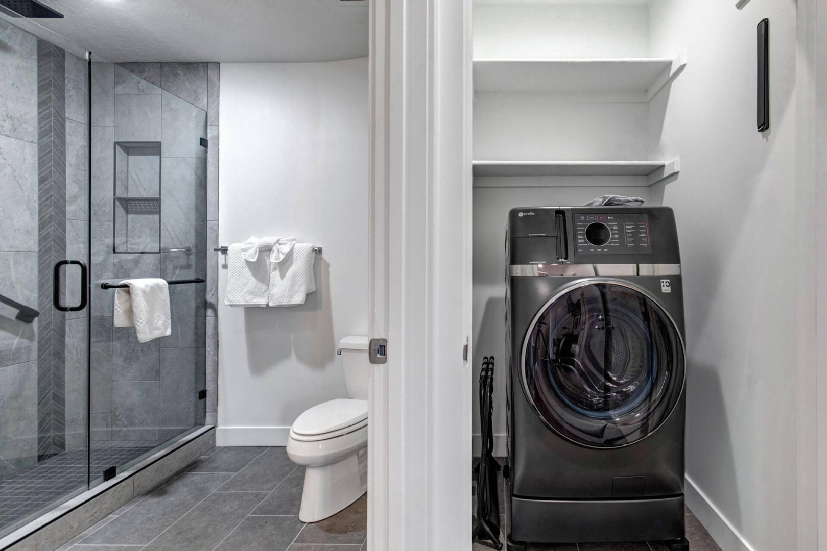 Freshen up in your private bathroom featuring a luxurious walk-in shower, plus enjoy the convenience of in-unit laundry facilities right at your fingertips.