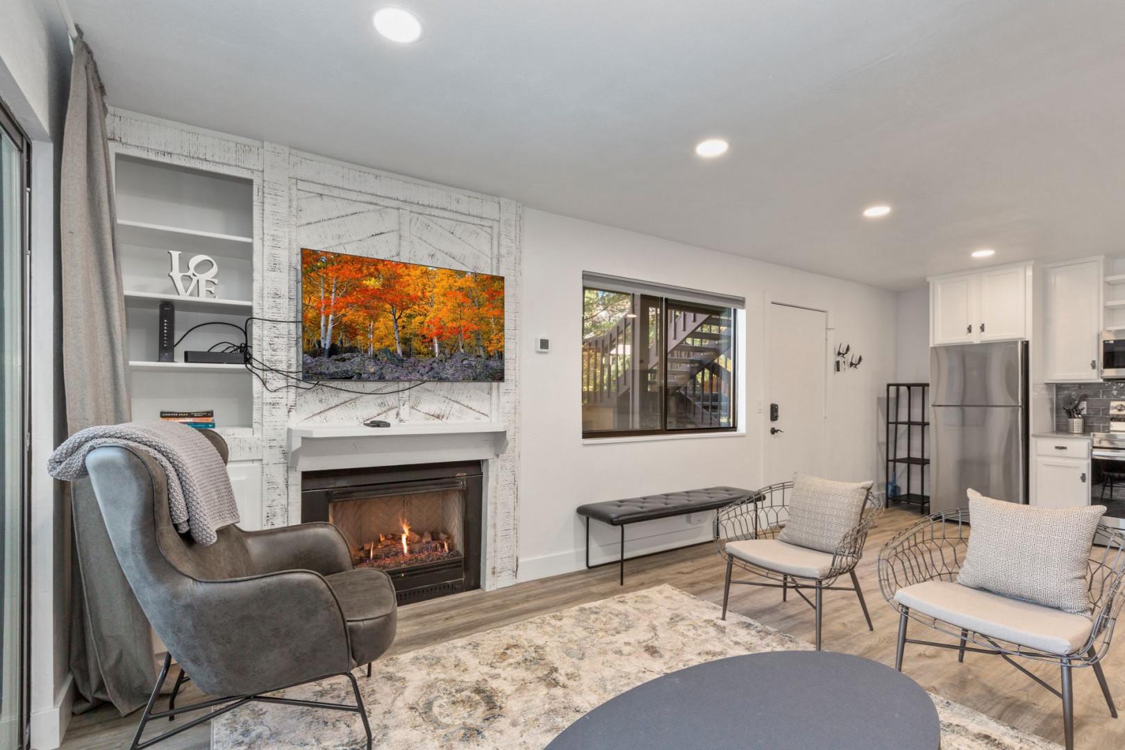 Warm ambiance with cozy fireplace, ample seating, and natural light.