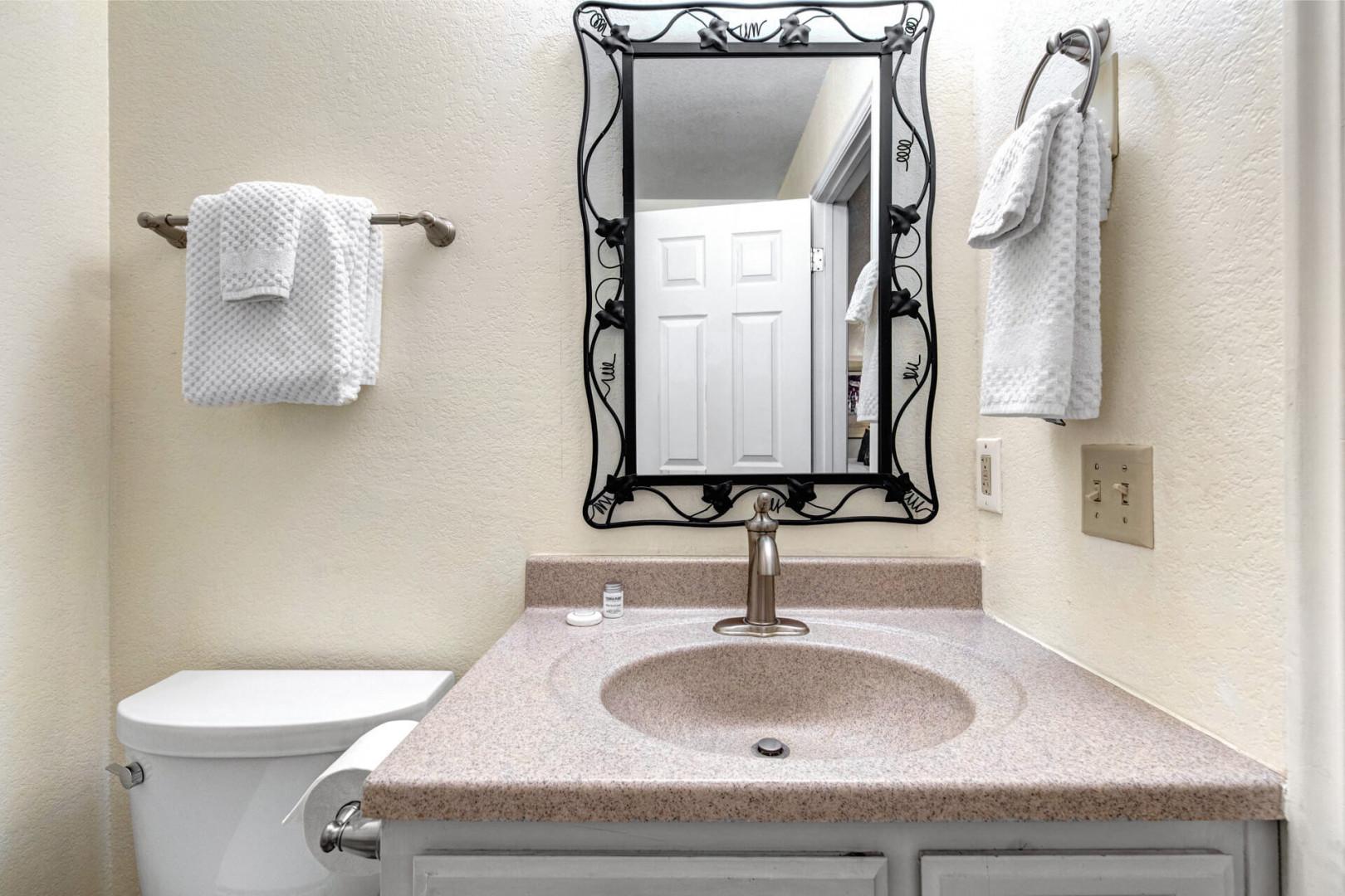 Your private bathroom awaits with fresh towels and everything you need for a comfortable stay.