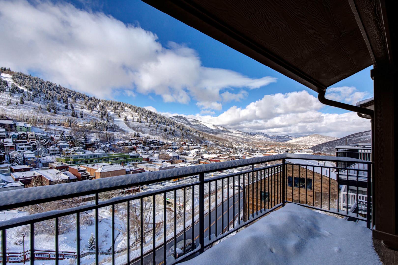 Upper Main 301: Spectacular mountain vista from your private balcony, where snow-capped peaks and charming village views create the perfect alpine retreat backdrop.