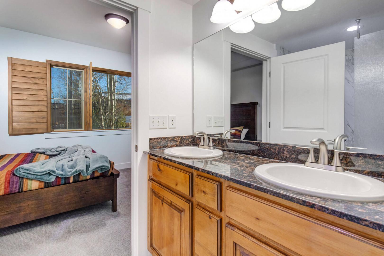 Your spacious bathroom features dual sinks and beautiful granite countertops, perfect for getting ready together each morning.