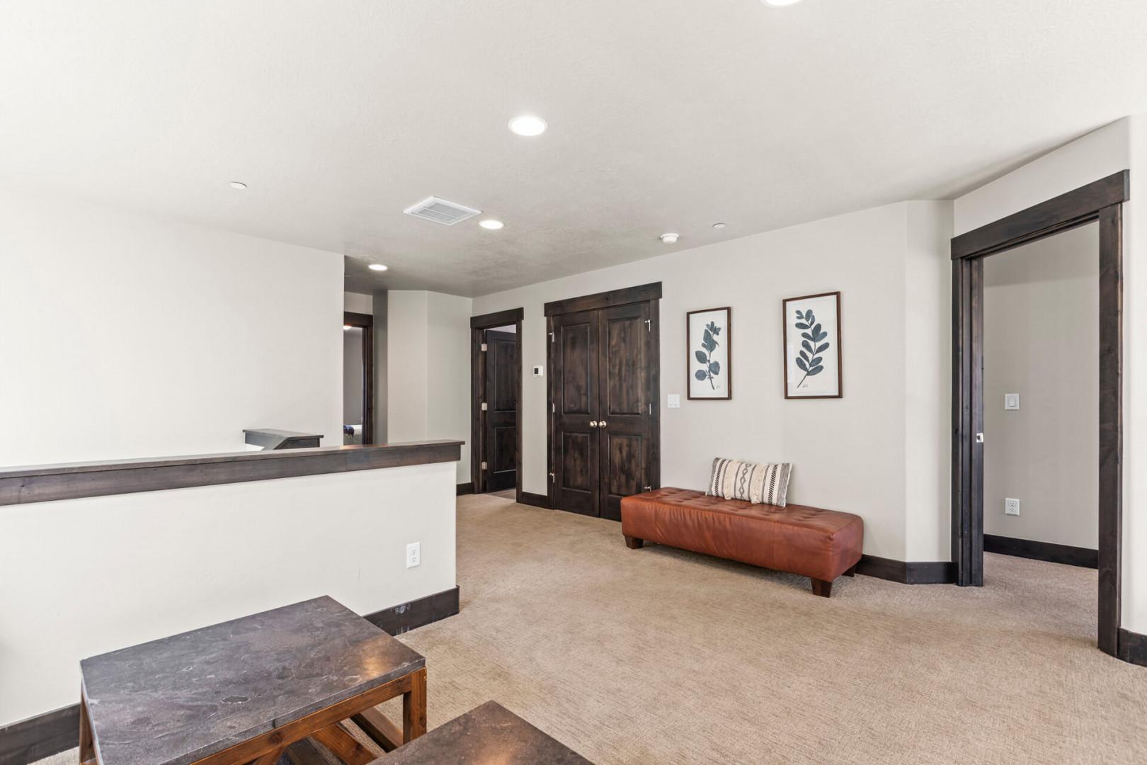 Relax in your welcoming lobby area with leather seating and botanical artwork, creating a perfect space to unwind.