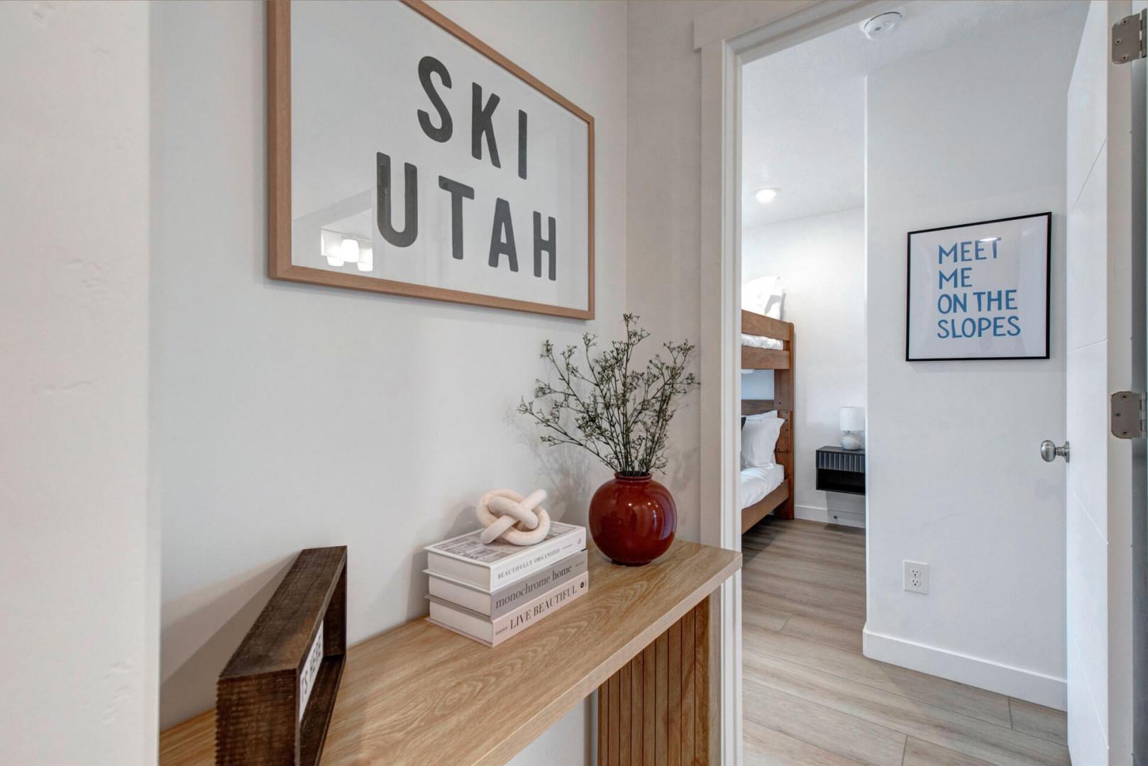 Step into your stylish mountain retreat where ski-themed décor and warm wood tones create the perfect alpine atmosphere for your Utah adventure.