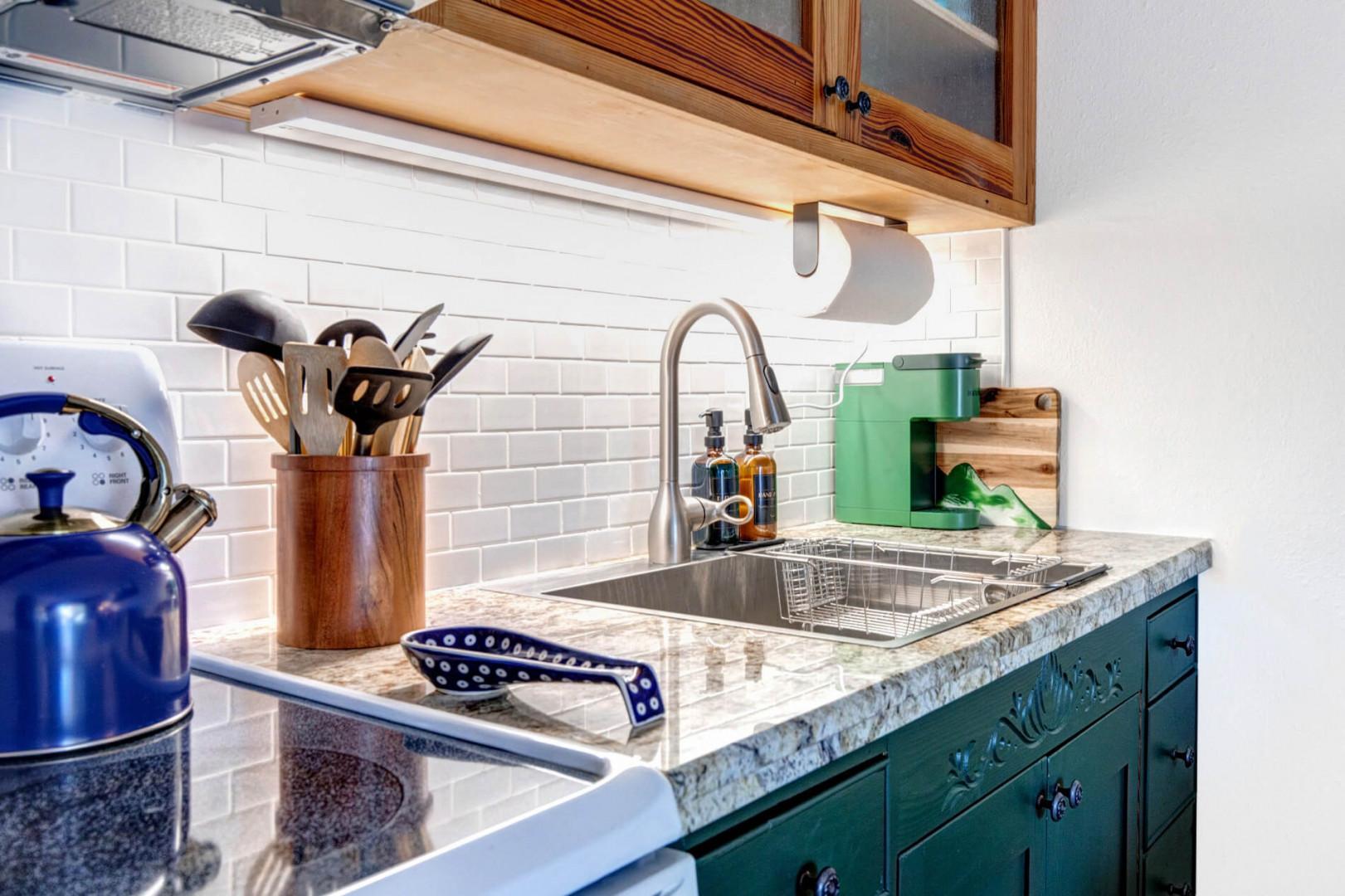 Cozy kitchen with coffee maker and electric range for culinary adventures.