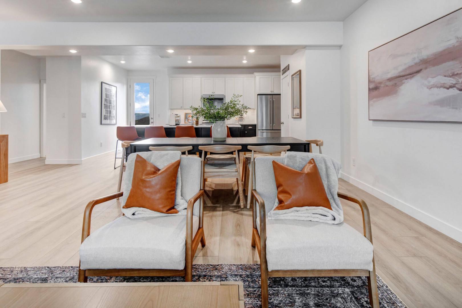 Relax in your stylish open-plan living space with plush seating, modern kitchen, and thoughtful design touches that make it feel like home.