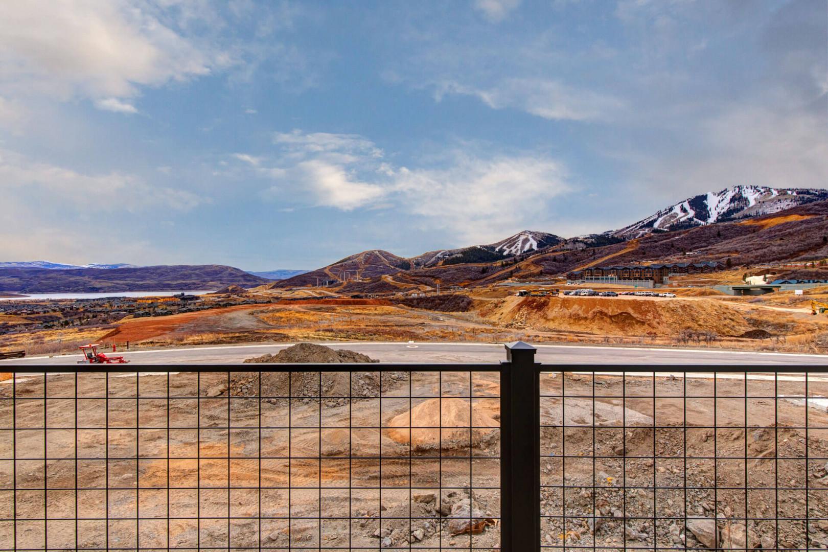 Spectacular mountain views with snow-capped peaks frame this property, located in a dramatic landscape of rolling hills and rugged terrain.