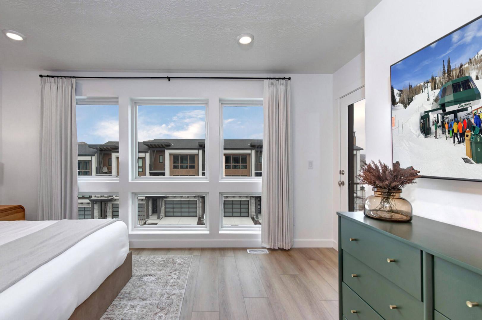 Unwind in your bright bedroom with mountain views and modern comfort for peaceful nights.