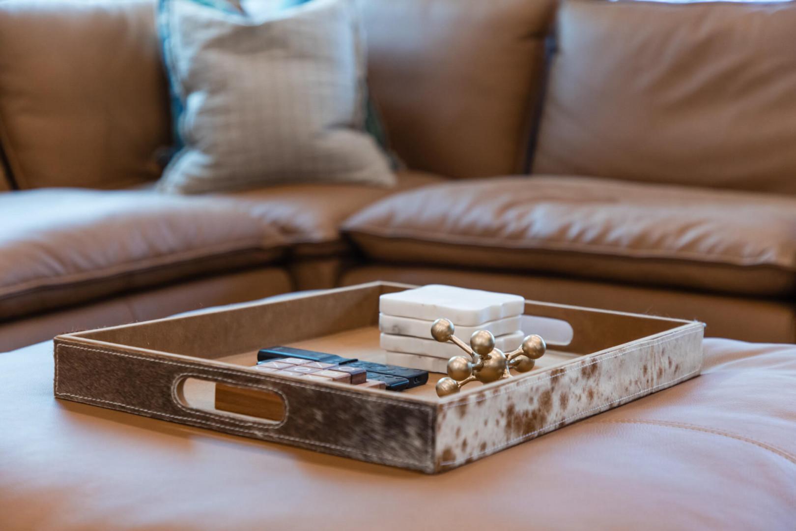 Sink into plush leather seating where thoughtful details create your perfect retreat for relaxation and conversation.