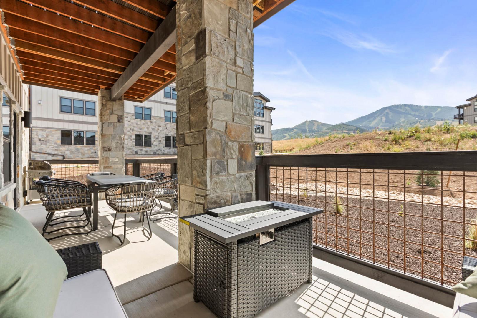 Sprawling mountain views frame your private patio, where comfortable seating and a pergola invite you to relax under open skies and take in the natural beauty surrounding the property.