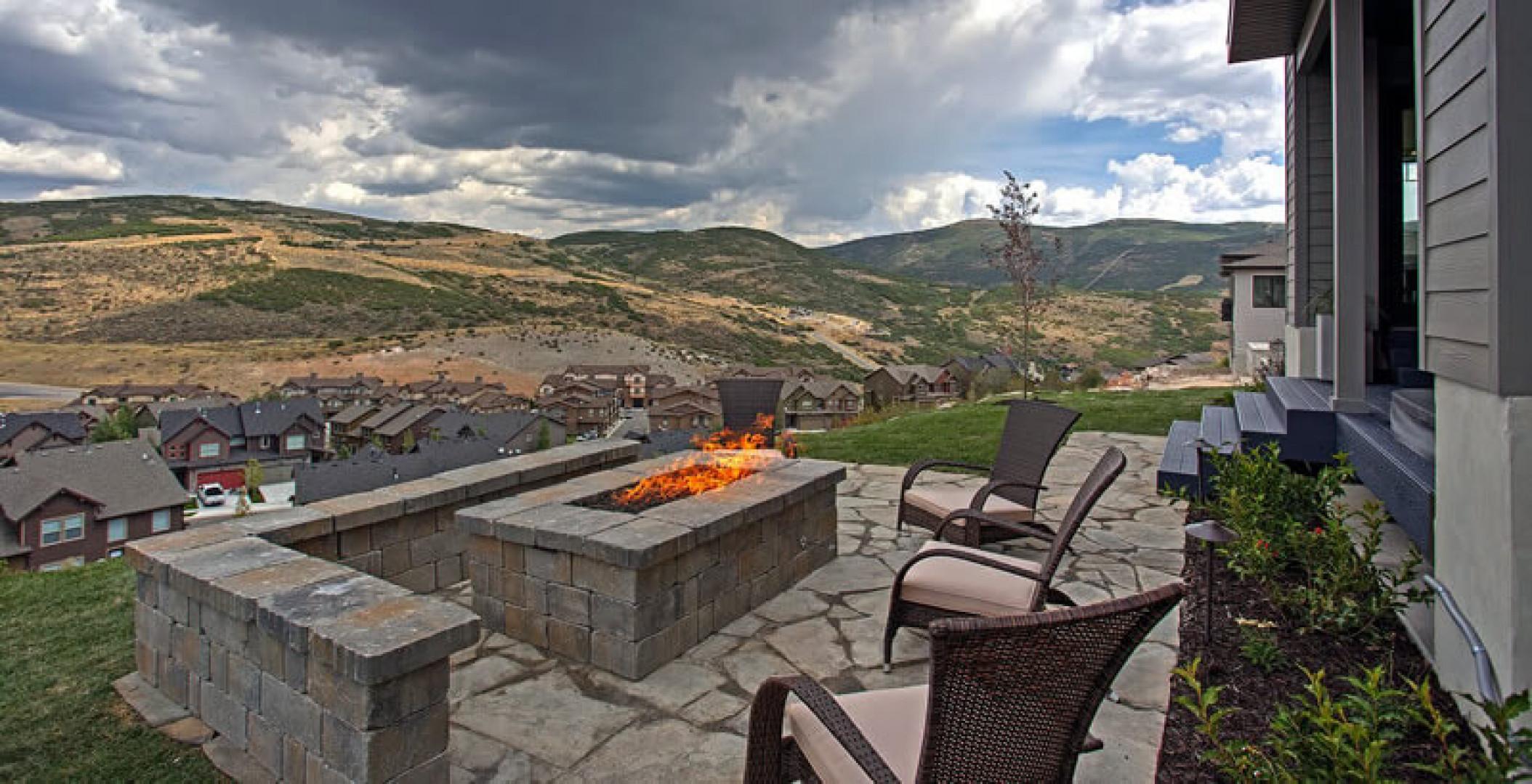 Unwind in your outdoor seating area with a crackling fire pit, dramatic mountain views, and plenty of space to gather under open skies.