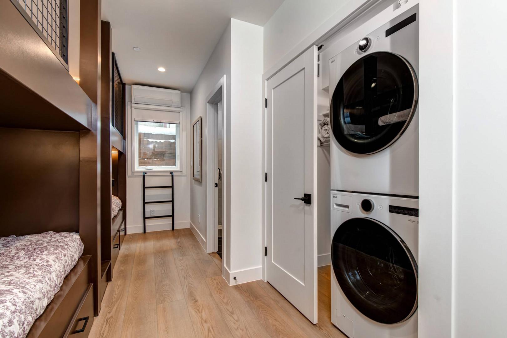 Upper Main 301: Your laundry stays effortlessly fresh with stacked washer and dryer tucked conveniently in the hallway.