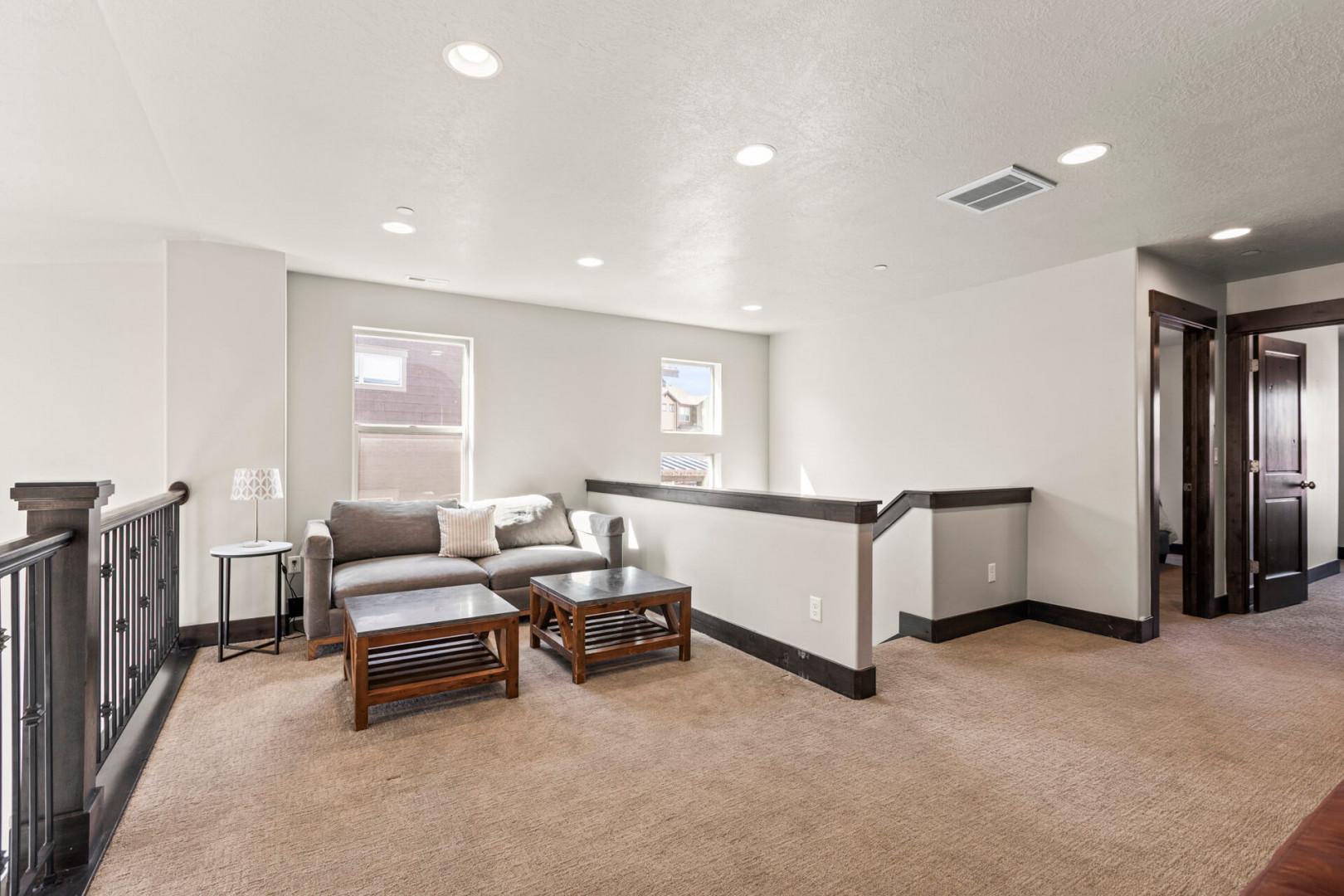 Relax in your private upstairs lounge with plush seating and natural light streaming through windows.