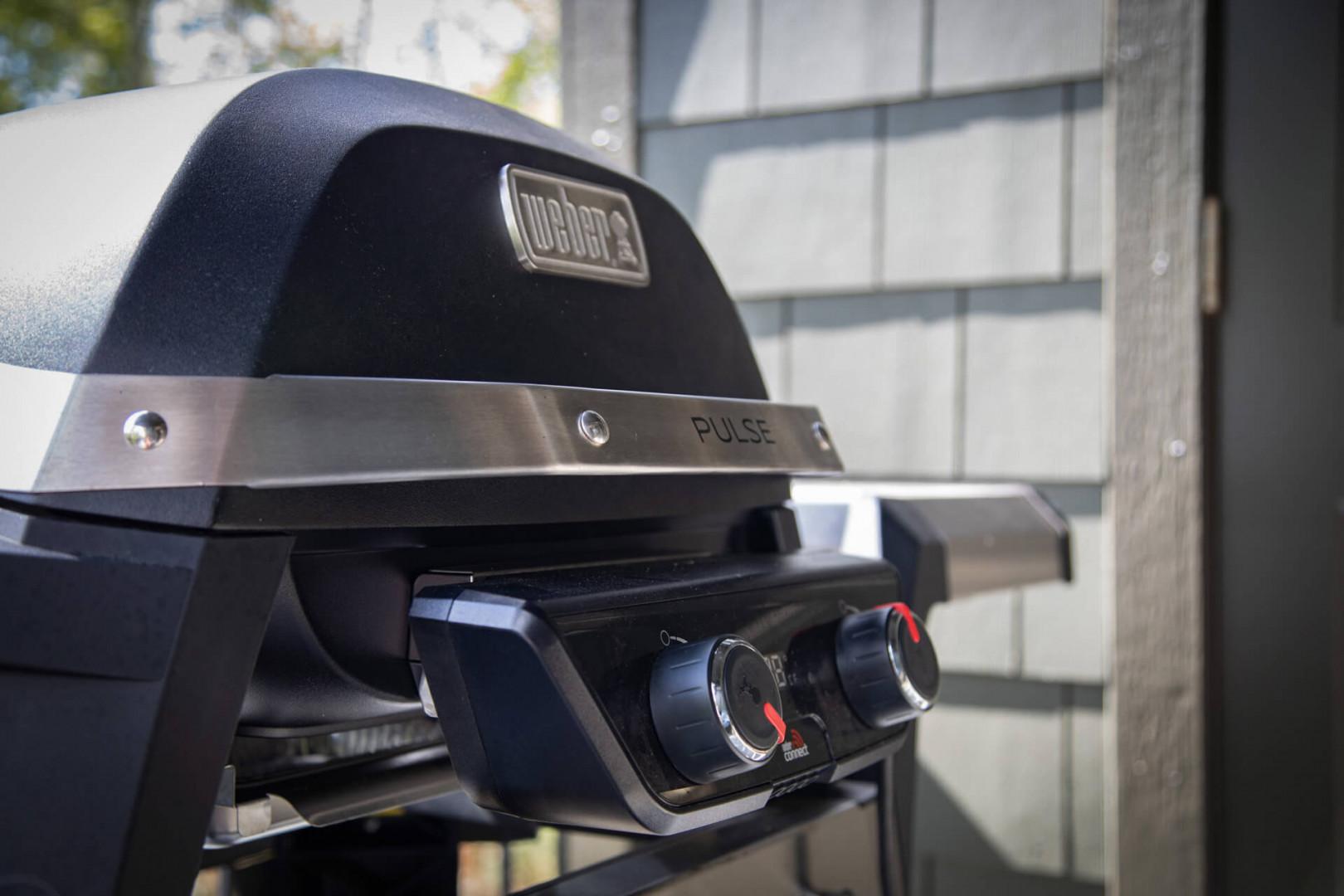 A Weber Pulse electric grill awaits your culinary adventures, combining convenience with outdoor grilling flavor on the private patio.