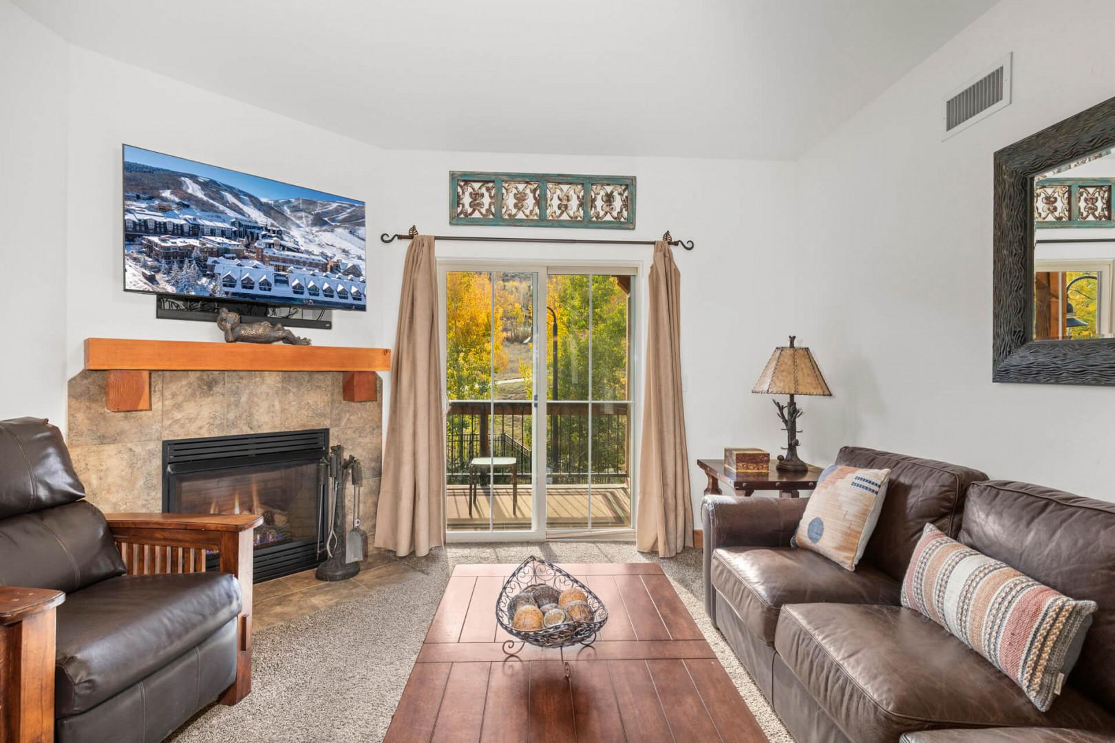 Vacation Rentals in Park City at Bear Hollow Lodges 1304: Living room with TV and gas fireplace