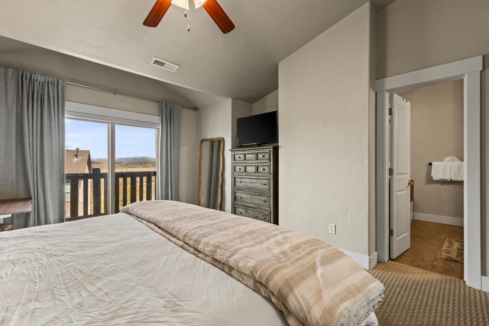 Relax in your comfortable bedroom with mountain views from your private balcony and ensuite bathroom just steps away.