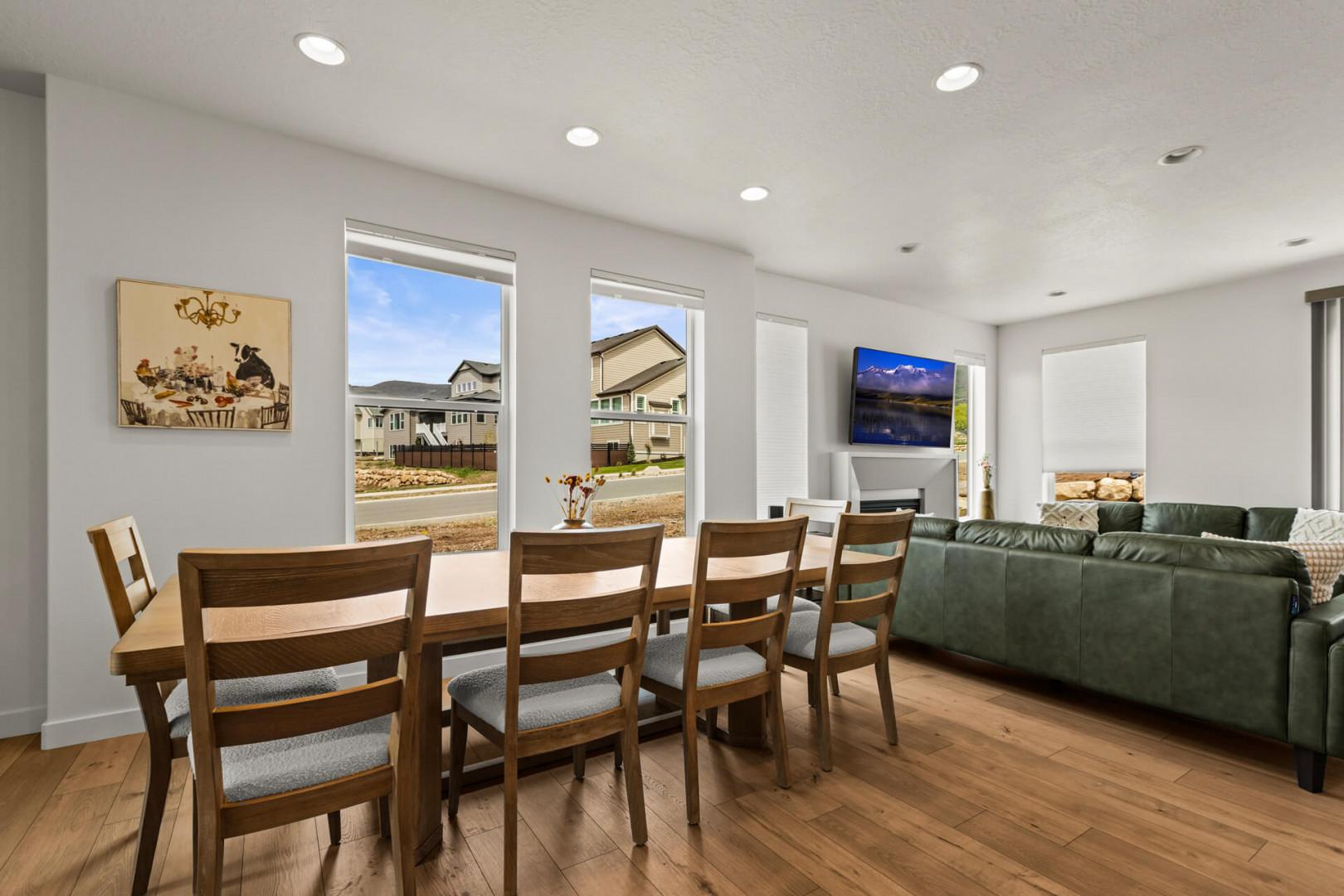 Gather around your spacious dining table for memorable meals, then sink into the plush sofa to unwind while natural light streams through large windows.