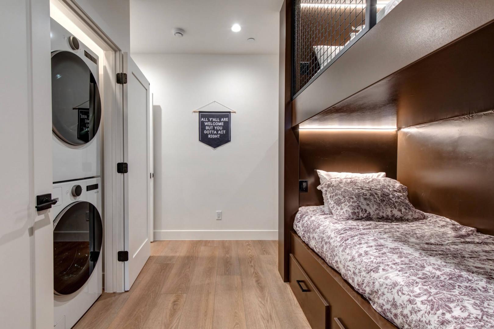 Upper Main 301: Your cozy built-in bunk feels like a private retreat, with warm wood tones and soft lighting creating the perfect reading nook.