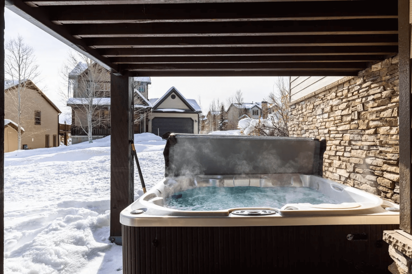 Soak in your private hot tub while snow falls around you, creating the perfect winter retreat.