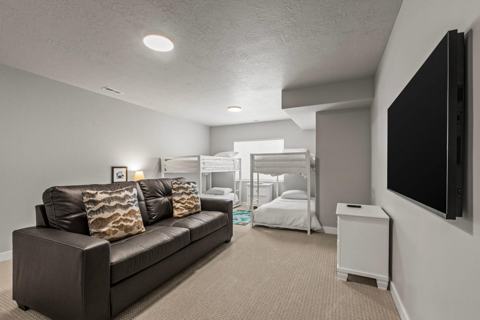 Your family room features comfy leather seating and bunk beds, perfect for movie nights and cozy gatherings.