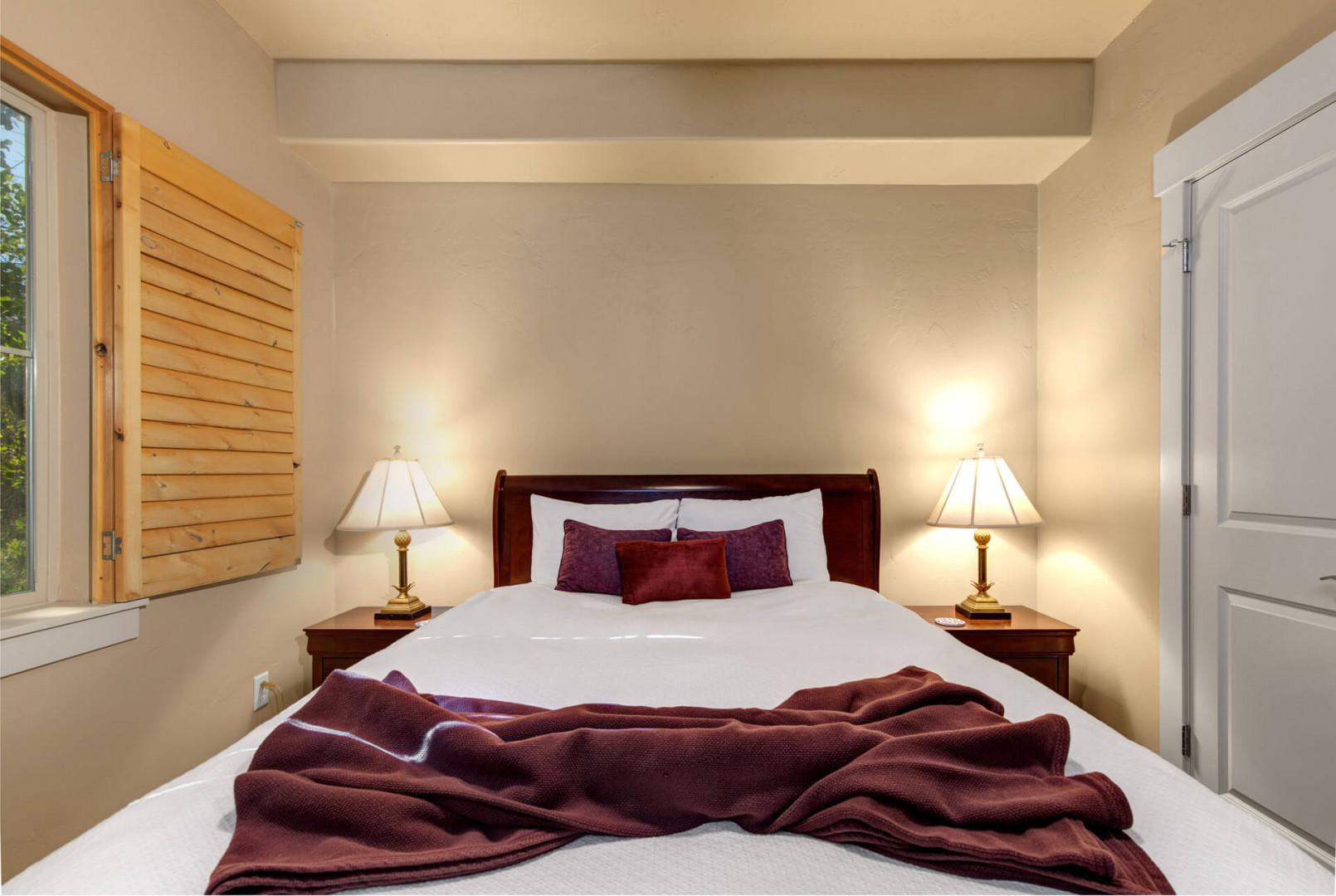 Slip into your serene bedroom retreat, where warm lighting and soft linens await to wrap you in comfort after a day of adventure.