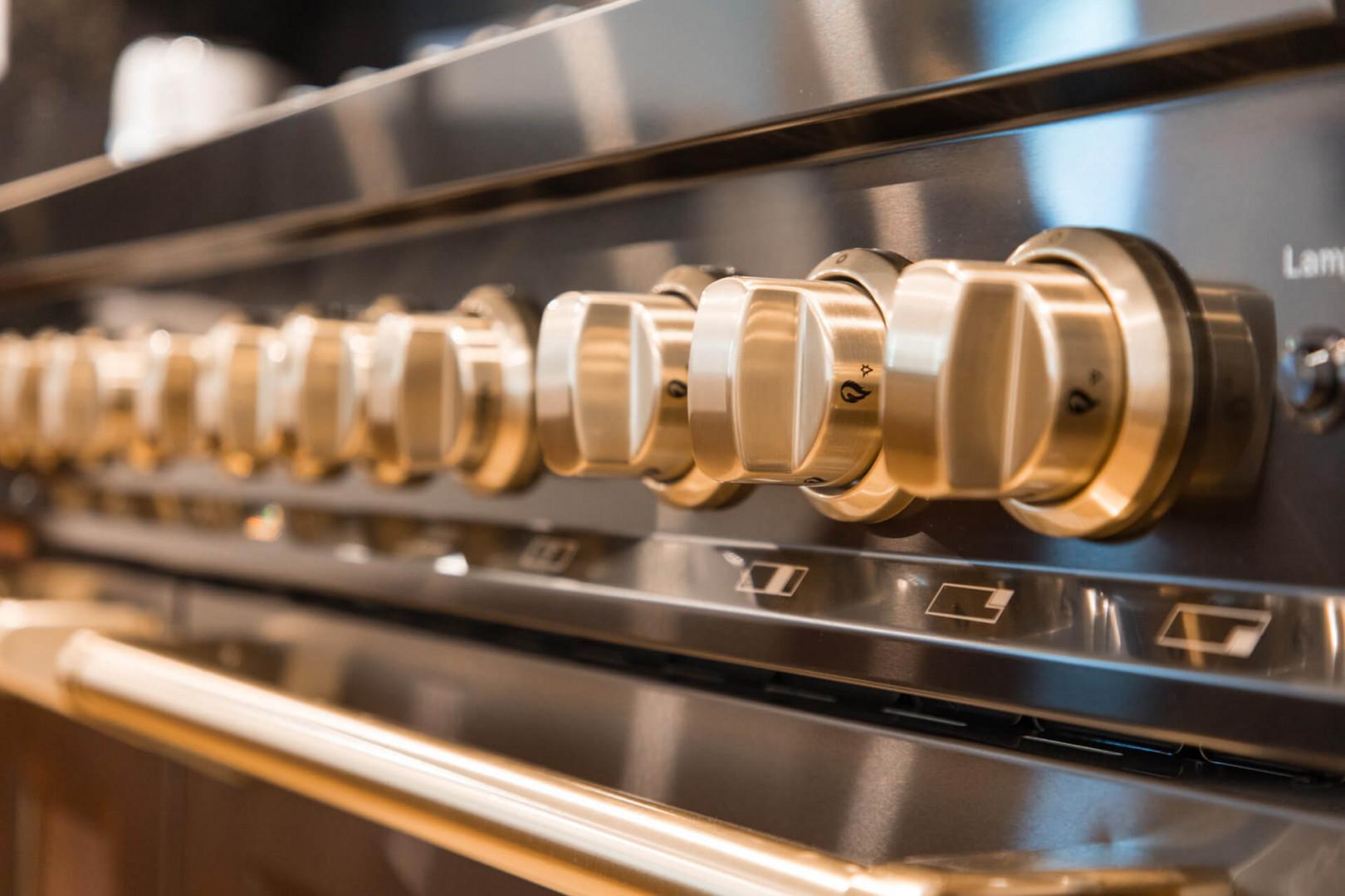Upper Main 301: Cook your favorite meals with this sleek stainless steel oven featuring elegant brass controls.