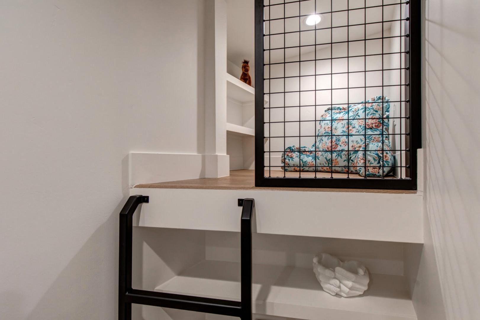 Upper Main 301: Your cozy reading nook awaits with built-in shelves and warm wood accents, perfect for unwinding with a book.