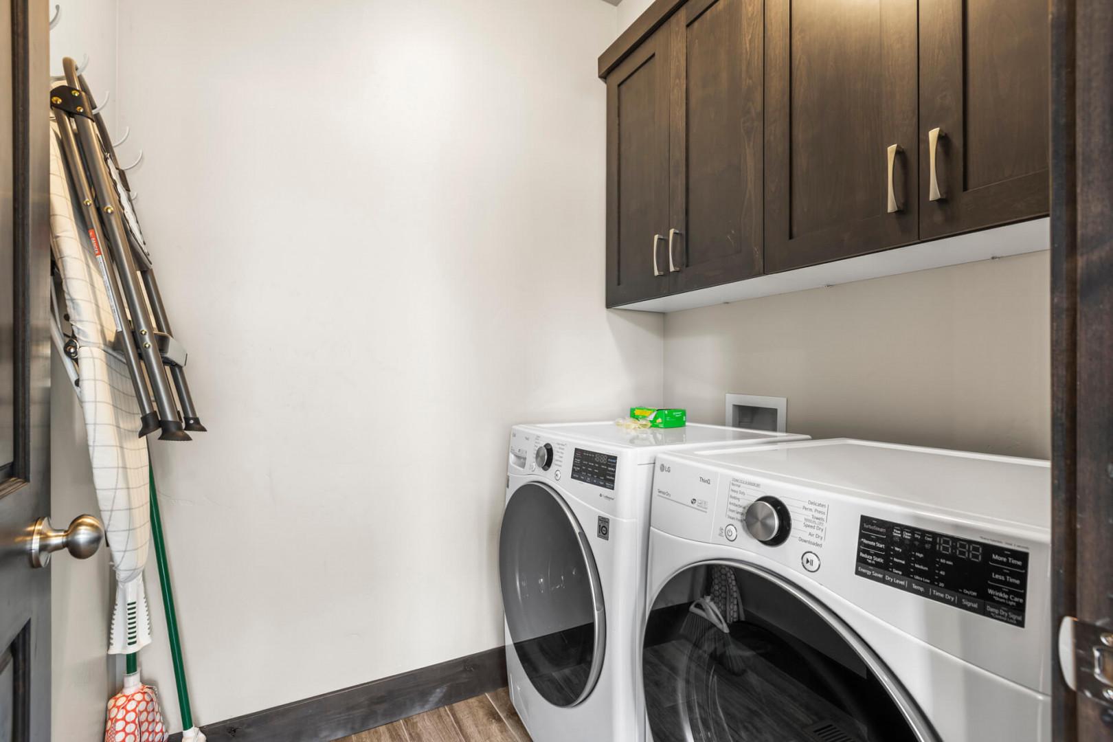 Keep your vacation wardrobe fresh in this well-equipped laundry room with modern appliances and ample storage for all your needs.