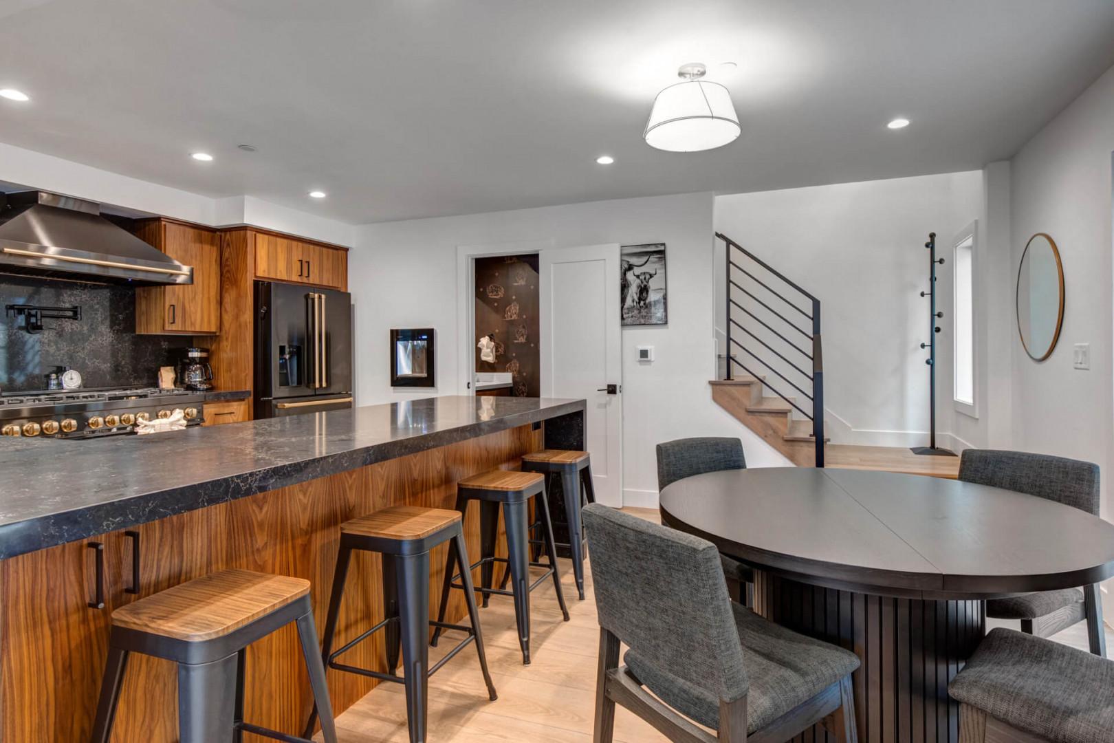 Upper Main 301: Your modern kitchen flows into a welcoming dining space, perfect for morning coffee or evening meals together.
