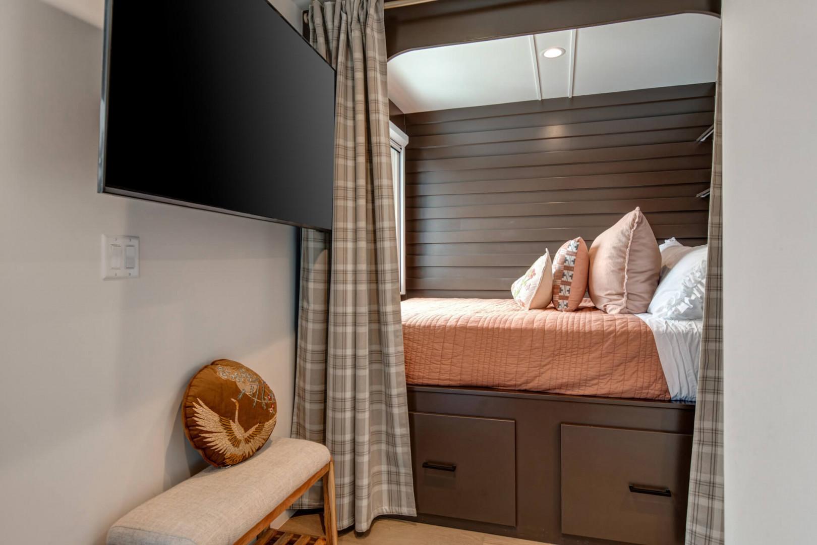 Upper Main 301: Sink into your cozy built-in bed nook with plush pillows and soft lighting, perfect for restful nights after adventures.