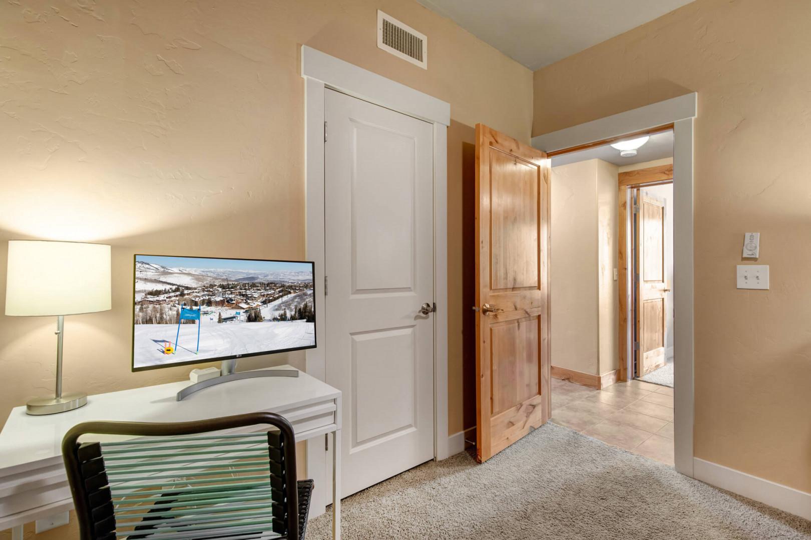 Relax after your day on the slopes with entertainment on the flat-screen TV. Warm tones and natural wood details create a welcoming retreat for your mountain getaway.