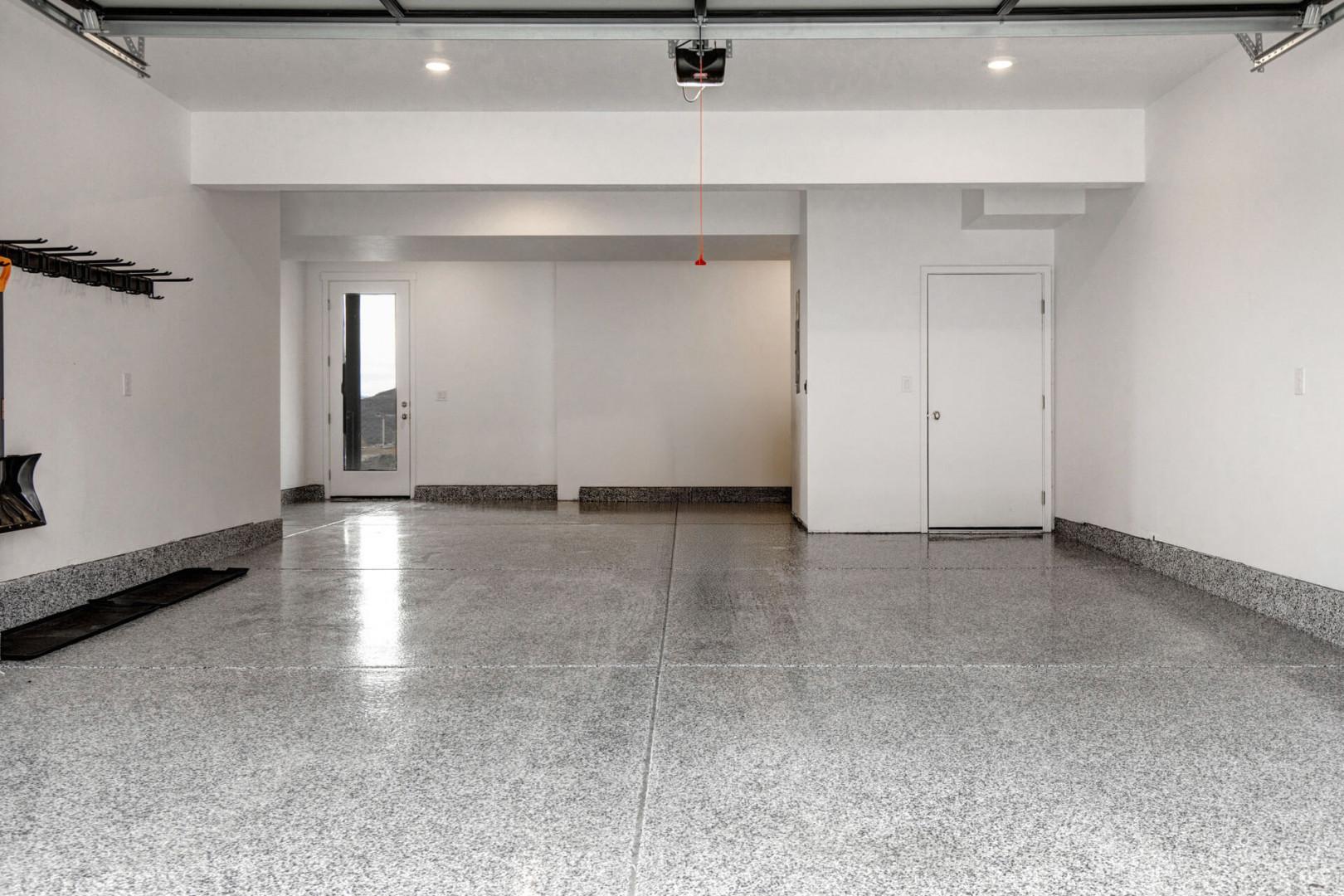 Your private garage offers secure parking with premium epoxy flooring, organized storage systems, and convenient door access to your rental.