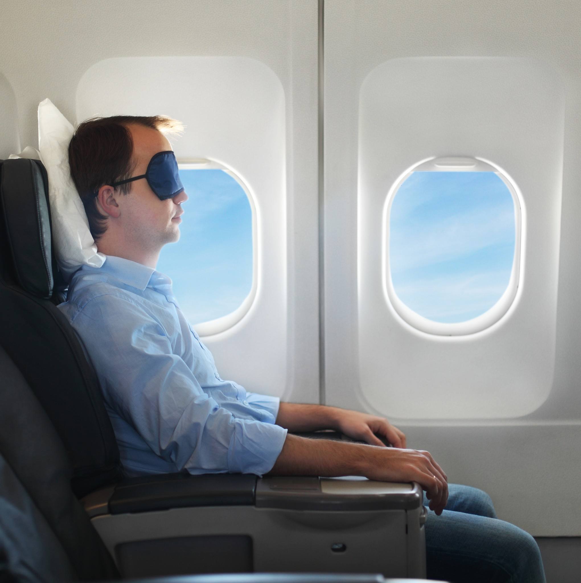 How To Sleep On A Plane (5 Tips To Help You Sleep More Comfortably)