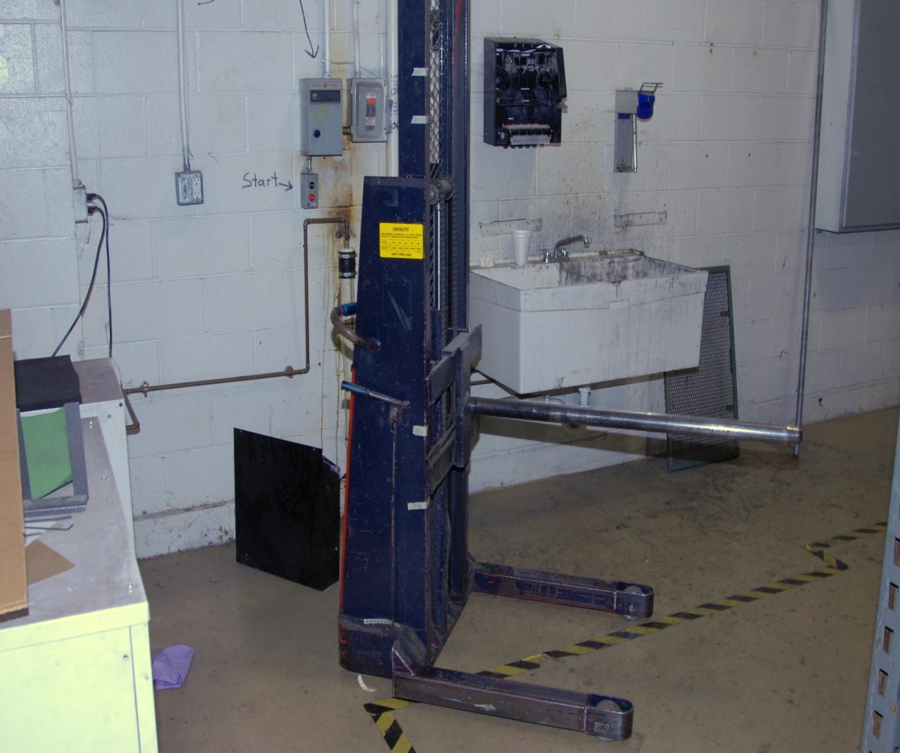 Lot 14 Walkbehind electric paper roll lift. WireBids