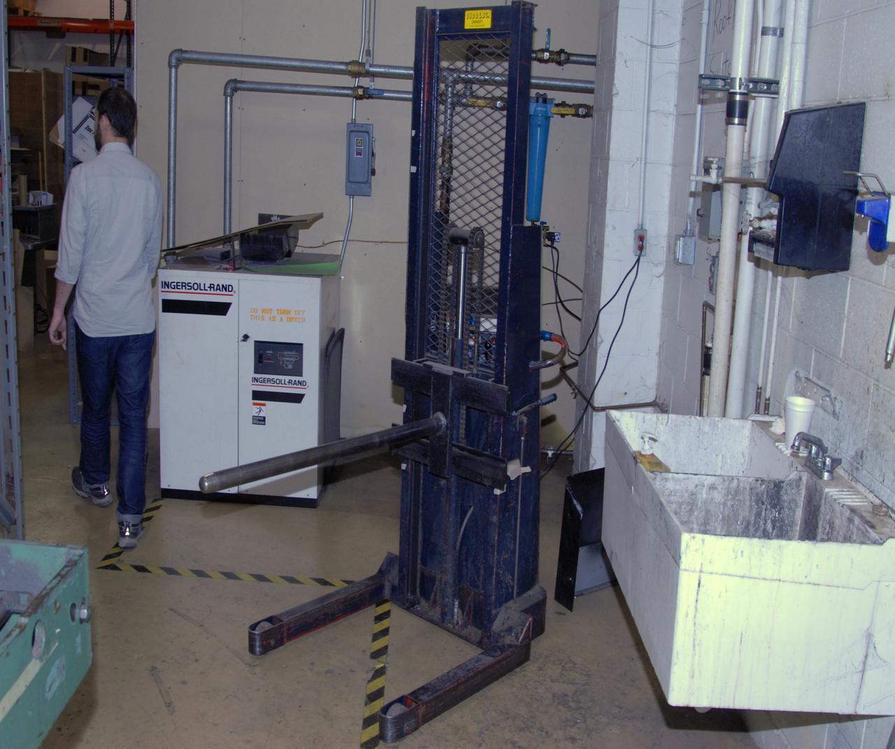 Lot 14 Walkbehind electric paper roll lift. WireBids