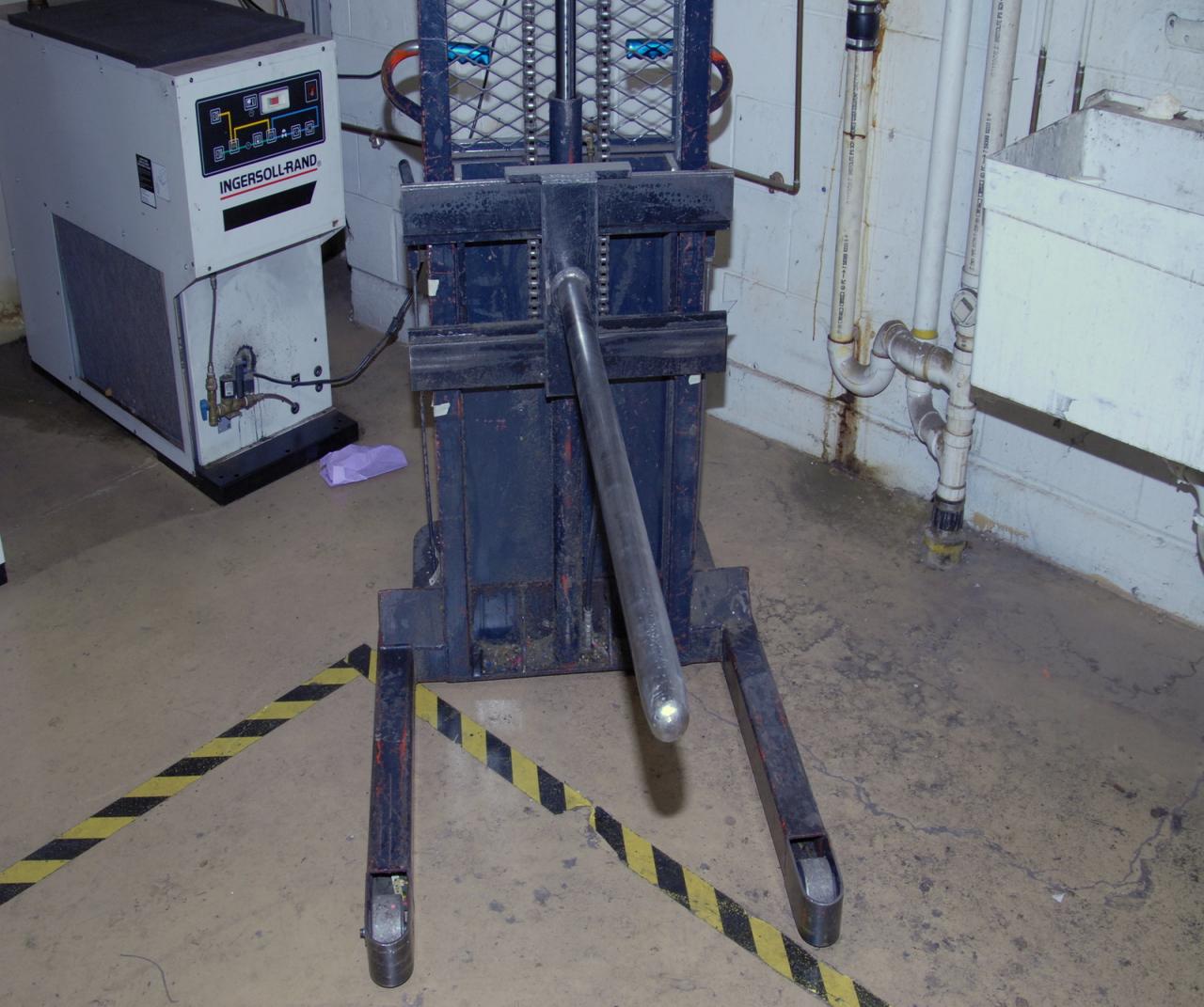 Lot 14 Walkbehind electric paper roll lift. WireBids