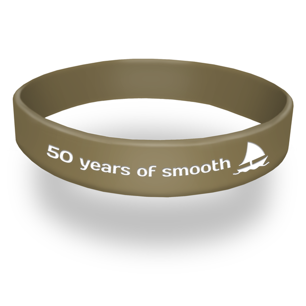 metallic gold silicone wristband with the words 50 years of smooth sailing