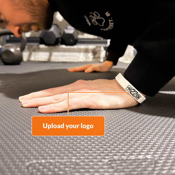 white wristband with mission 22 logo