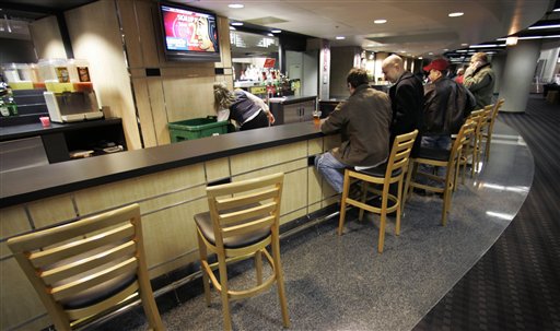 The UC bar stools may be empty at Blackhawks games for a while. (AP/M. Spencer Green)