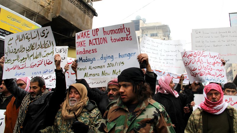 Demonstrators in Idlib, Syria, protested Tuesday on behalf of civilians starving in the besieged town of Madaya, Syria. (Anadolu Agency/Getty Images)