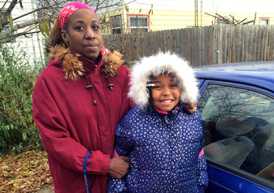 Angel Hinton with her daughter, Cameisha, 8. Hinton's business suffered after her license was suspended. (Joseph Shapiro/NPR)